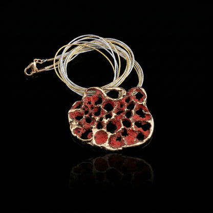 Perforata Lux pendant necklace, red perforated oval pendant with silver cord loop
