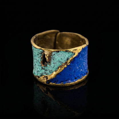Turquoise and blue enamel ring with gold-toned edging, open-texture design