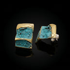 Terra earrings with turquoise stone fragments, gold edging, and silver backs