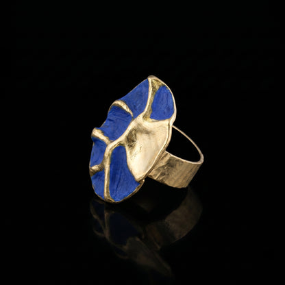 Blue enamel and gold-tone concept ring, top view