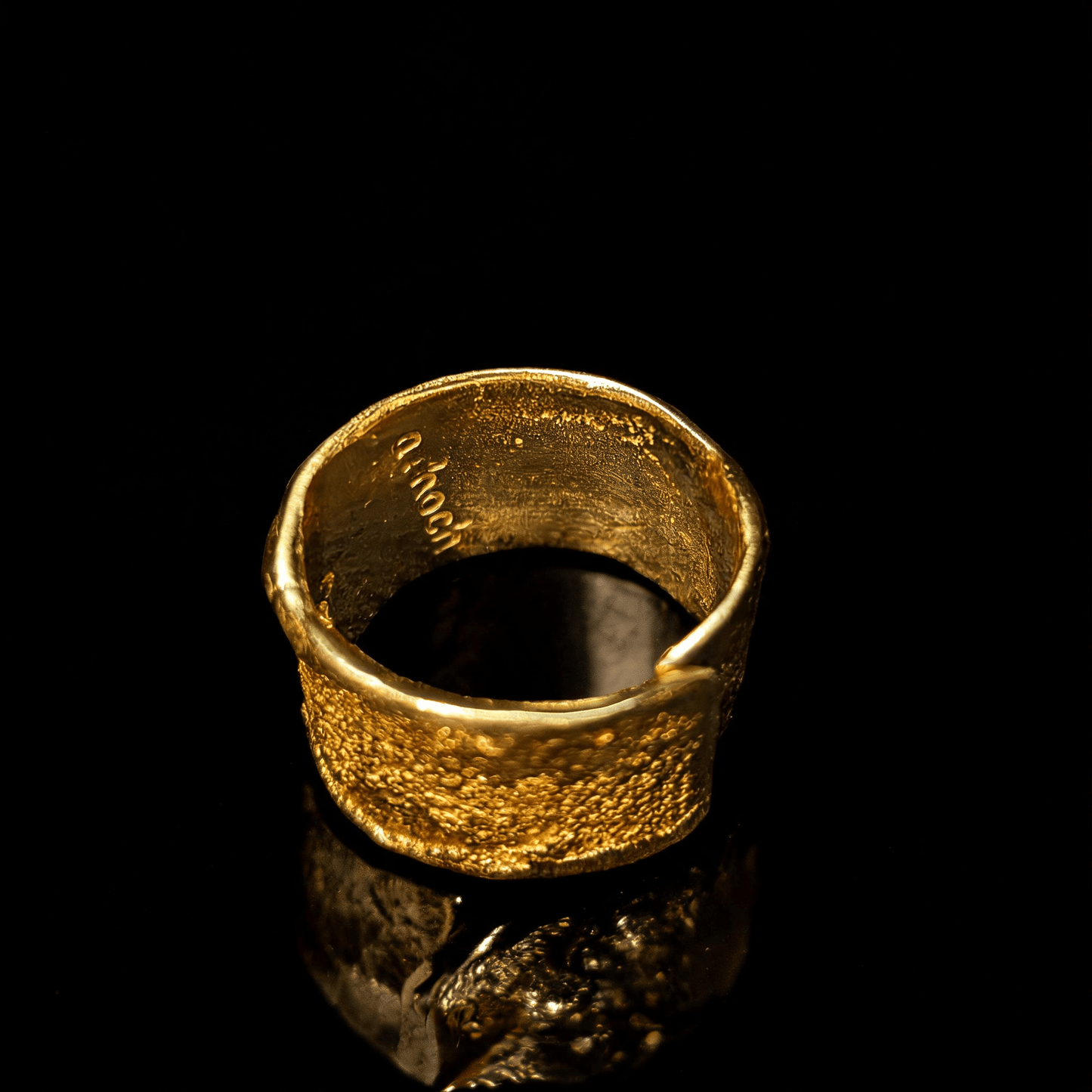 Gold wide band ring with hammered texture, inner polished finish visible
