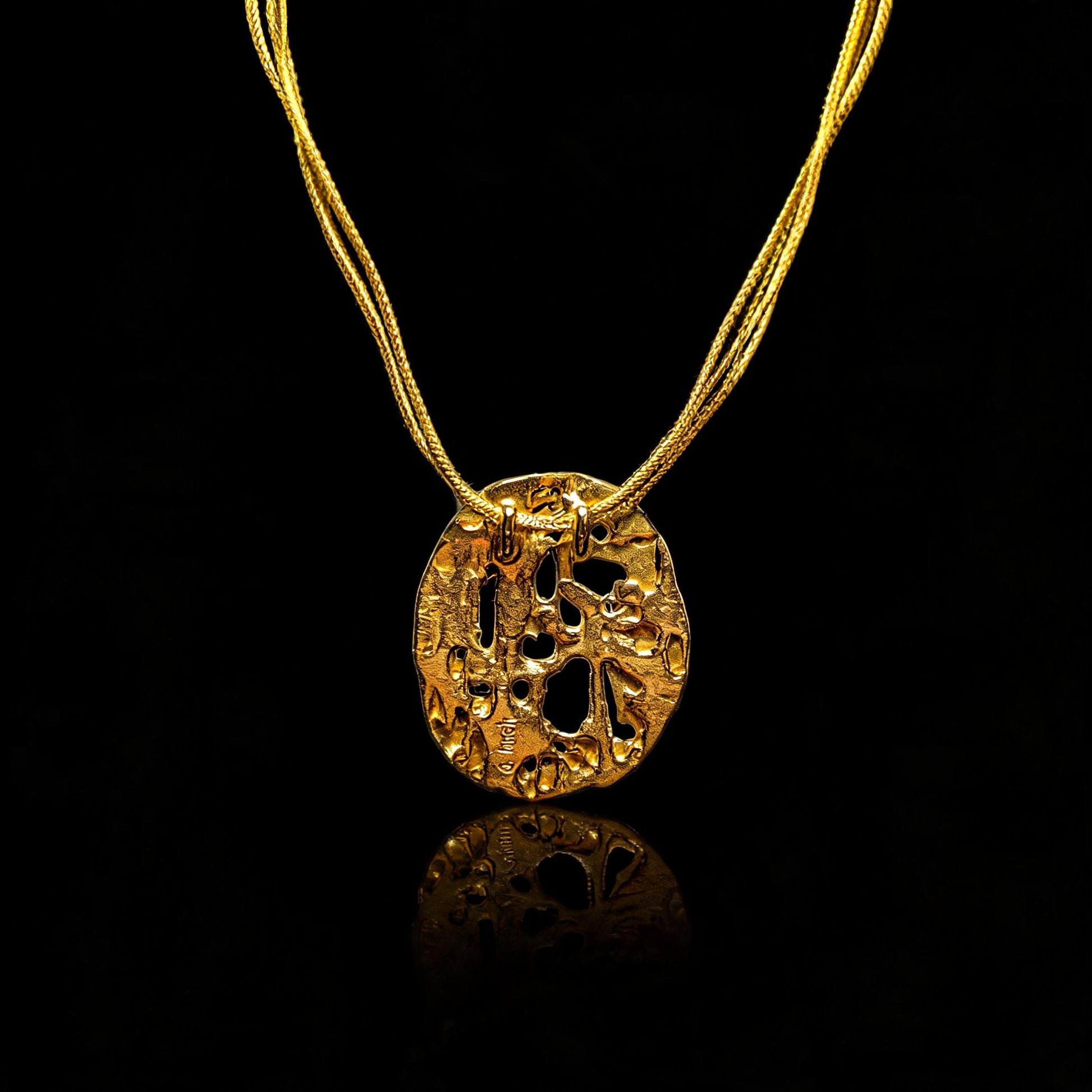 18K gold void pendant, front view on gold chain with loop